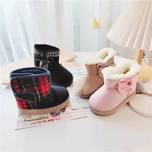 Cozy winter children's snow boots with thick fleece lining and cute bow details for toddlers.