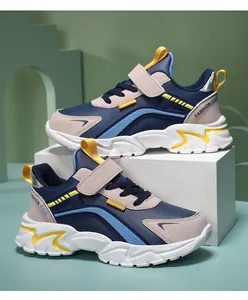 Side profile detail of lightweight kids' athletic running sneakers in navy and yellow