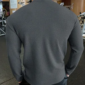 Men's athletic charcoal grey knitted sweater with vertical texture shown from back view.