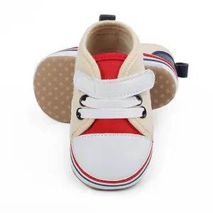 Zapatos suaves para primeros pasos de bebé en lona roja y beige con cierre velcro