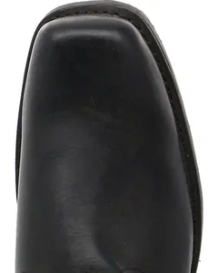 Macro detail of a square-toed black leather boot with stitched sole edge