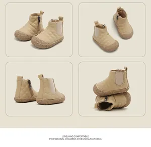 Detailed macro view of beige quilted toddler snow boots with rubber toe cap