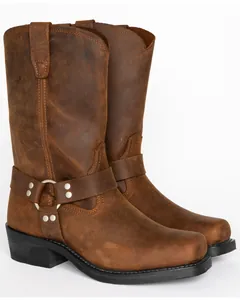 Detailed side view of rugged brown leather harness boots with metal ring accents