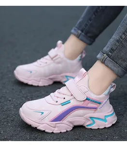 Close-up view of pink children's lightweight running shoes with durable velcro straps