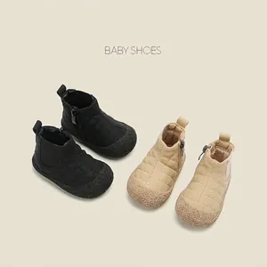 Warm fleece-lined baby snow boots with quilted pattern and side zipper closure