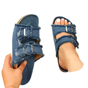 Stylish summer women's flat denim slides with frayed edges and double buckle straps