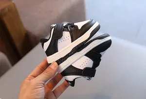 Close-up of classic black and white baby soft sole walking shoes with non-slip design