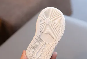 Close-up of non-slip rubber sole for toddler walking shoes with size 16 detail
