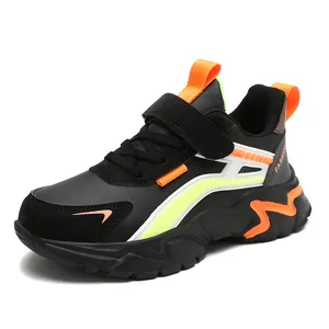 Black and orange non-slip children's athletic sneakers with durable chunky sole