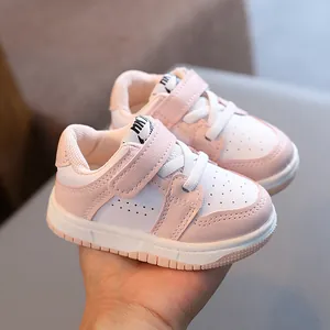 Pink and white soft sole baby walking sneakers for toddlers with Velcro strap closure