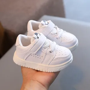 White soft-sole toddler sneakers for babies 0-3 years, casual infant walking shoes.