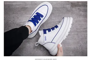 Detailed view of stylish men's high-top white sneakers with blue buckle straps.