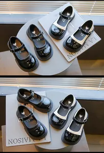 Detailed macro view of retro black and white bicolor Mary Jane shoes for girls