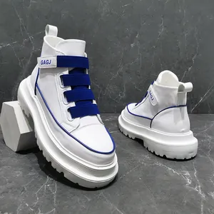 Close-up of trendy white high-top sneakers with blue buckles and thick soles