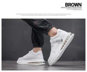 Detailed view of white mid-top casual shoes for men with visible air cushion sole