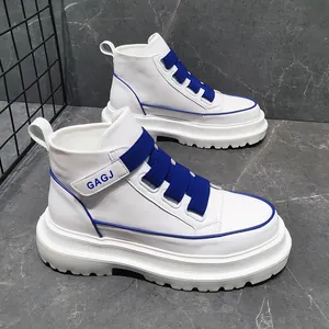 Close-up detail of high-top white men's sneakers with blue elastic straps and GAGJ logo