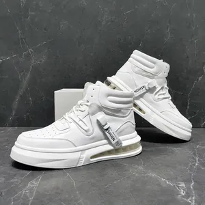 Close-up of stylish white mid-top men's fashion sneakers with side strap detailing.