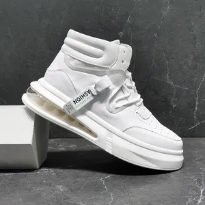 Detailed side view of white mid-top sneakers featuring air cushion and fashion tag
