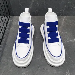 Top-down view of men's white high-top sneakers with blue elastic straps and thick platform soles