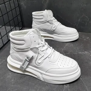 Detailed view of stylish white mid-top sneakers with chunky soles and air cushions.