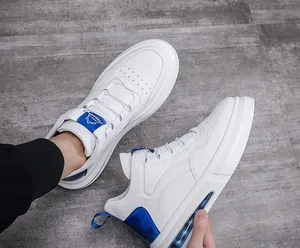 Macro view of white men's sneakers with air cushion and blue accents