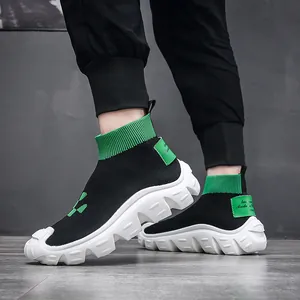 Breathable flyknit sock sneakers for men with chunky white sole and green accents