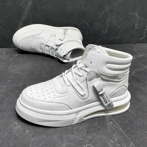 Detailed view of white mid-top sneakers with thick soles and air cushions