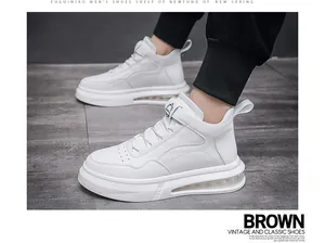 Detailed close-up of white fashion men's high-top sneakers featuring comfortable air cushion sole
