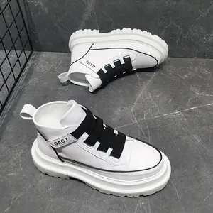 Detailed view of trendy white high-top sneakers with black straps and thick soles