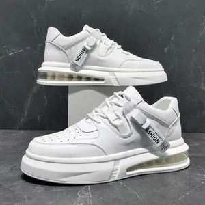 Close-up of stylish white mid-top men's sneakers with air cushion and decorative tags