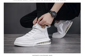 Close-up of stylish white high-top men's sneakers with comfortable air cushion sole.