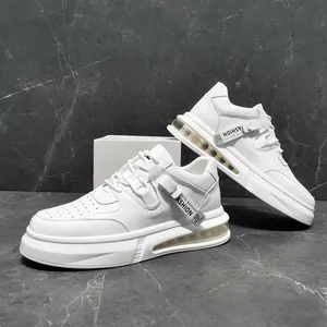 Detailed view of white mid-top sneakers with air-cushioned sole and decorative tag.