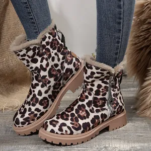 Close-up of leopard print snow boots with cozy fur lining and side zipper details.