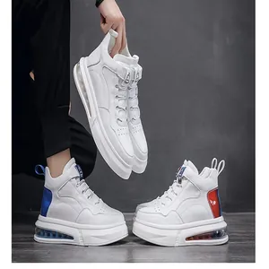 Macro view of men's white high-top sneakers featuring a transparent air cushion sole