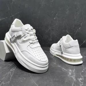 Detailed view of white mid-top men's casual sneakers featuring air cushion soles
