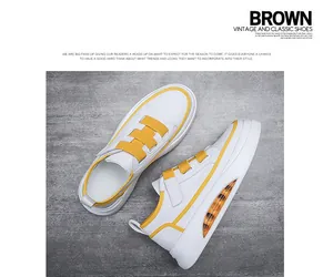 Detailed view of white and yellow men's casual sneakers with visible air cushion sole.
