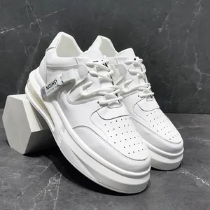 Side view of stylish white mid-top men's casual sneakers with decorative tag detail