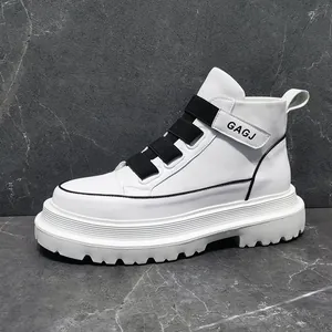 Side detail of white high-top men's sneakers with black buckle straps and thick soles