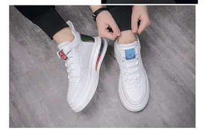 Detailed view of trendy white high-top sneakers with visible air cushion sole unit