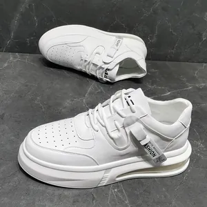 Side view of trendy white men's sneakers on a sleek marble textured background