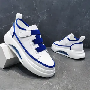 Detailed macro view of white and blue color blocking men sneakers with thick air cushion sole