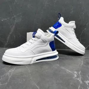 Detail view of white high-top sneakers with blue metallic accents and air cushion sole