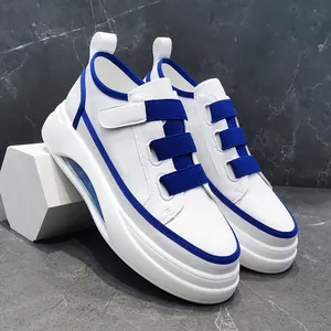 Detailed side view of men's chunky sneakers with blue elastic straps and air cushion
