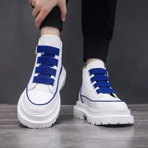 Men's stylish white high-top sneakers with blue straps and thick soles for a trendy look.