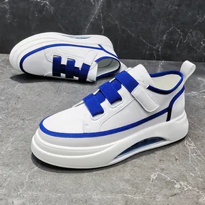 Stylish men's fashion sneakers with blue and white color block and air cushion sole