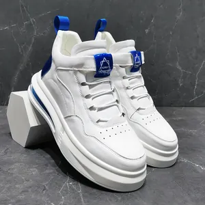 Macro view of white high-top men's sneakers featuring blue air cushion and leather texture