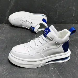 Detailed view of white high-top sneakers with blue metallic accents and air cushion sole.