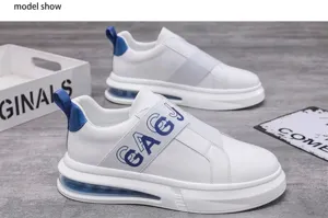 Detailed view of white men's slip-on sneakers with blue elastic band and air sole cushion.