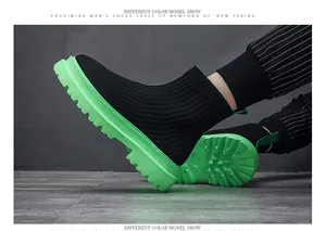 Close-up side view of men's high-top breathable knit sock sneakers with green sole