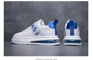 Close-up of white men's sneakers with blue accents and air cushion sole.